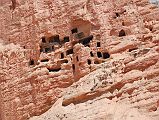 Mustang 03 04-3 Drakmar Red Cliffs Caves Above the houses of Lower Drakmar are many ancient cave dwellings.